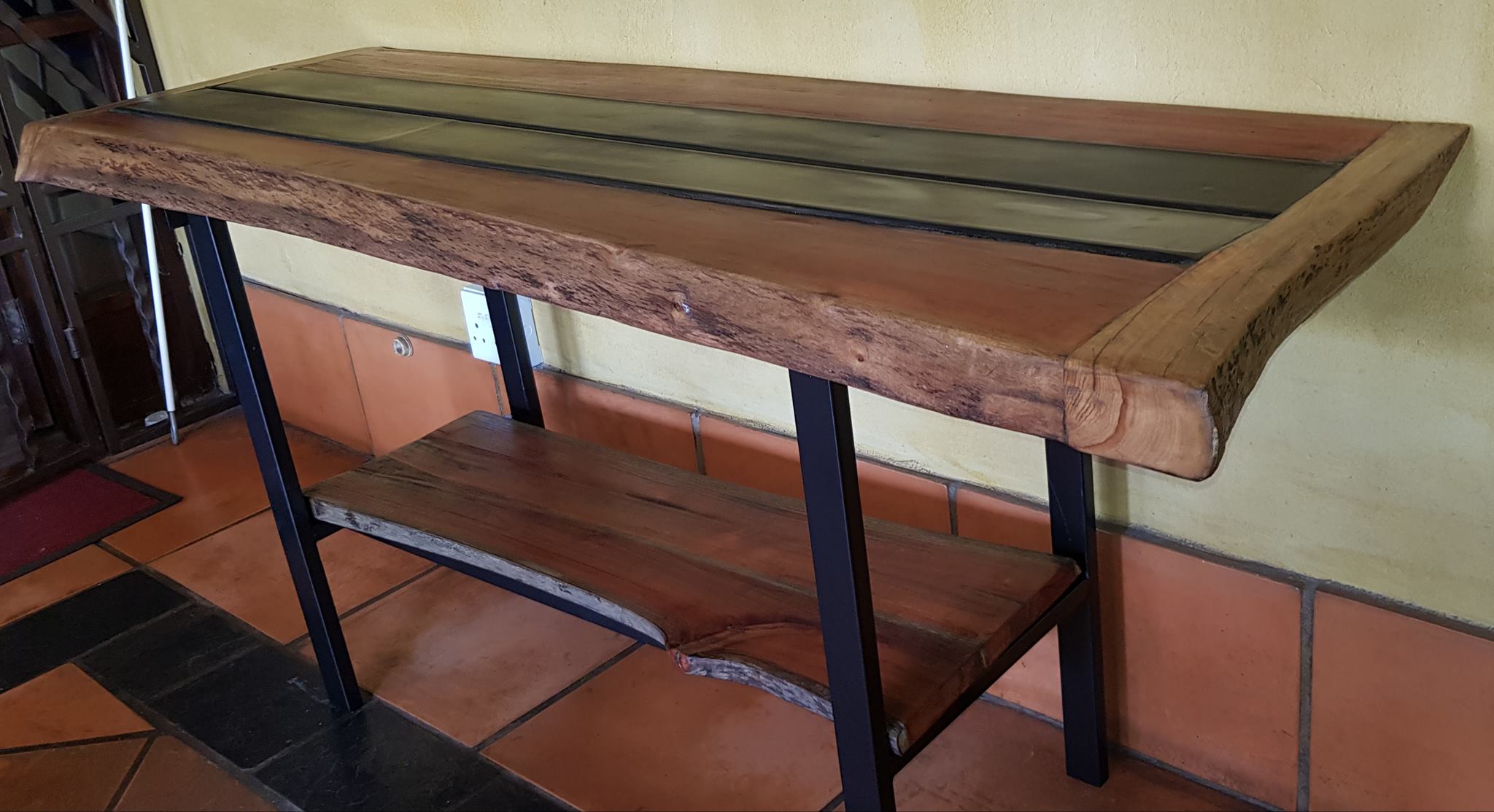 Combination of live edge slabs and steel lengths all reclaimed materials coll...
