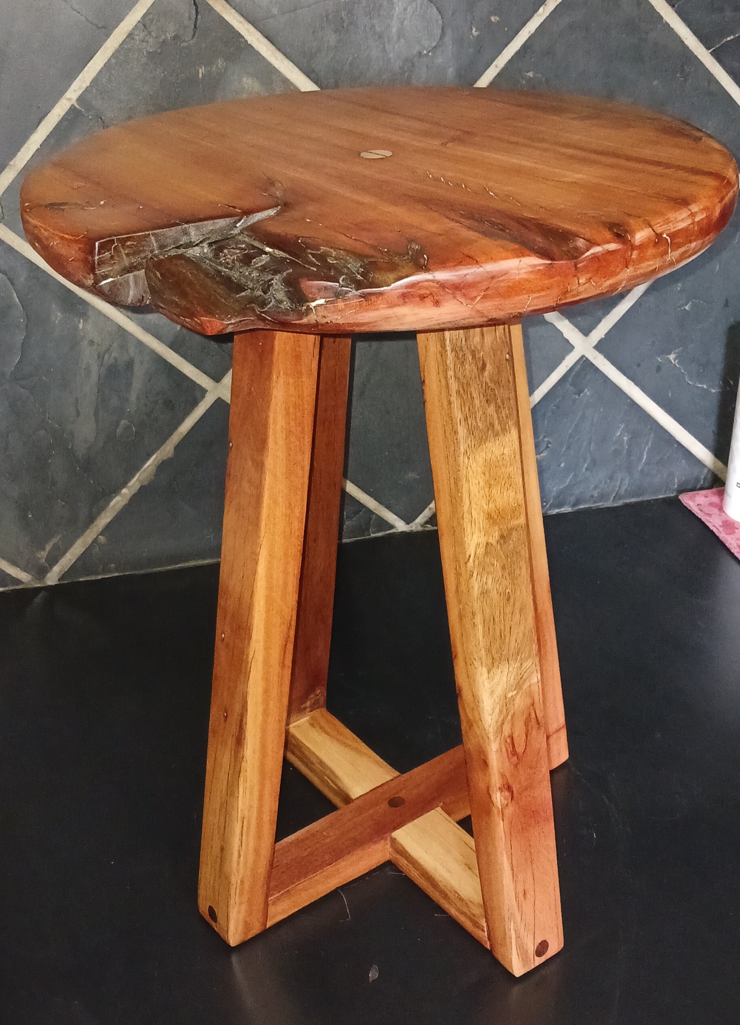 Solid eucalyptus side table with live edge feature